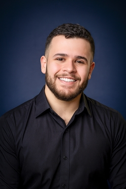 Gustavo Garcia using a formal shirt with his arms crossed